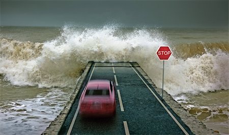 car rushing along the highway towards the giant wave Stock Photo - Budget Royalty-Free & Subscription, Code: 400-04176993