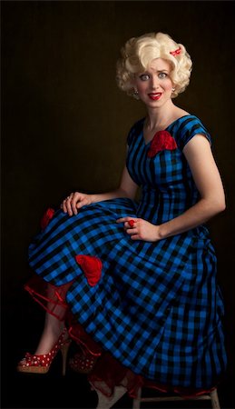 simsearch:400-04681336,k - Tense retro blonde woman in vintage 50s dress Stock Photo - Budget Royalty-Free & Subscription, Code: 400-04177364