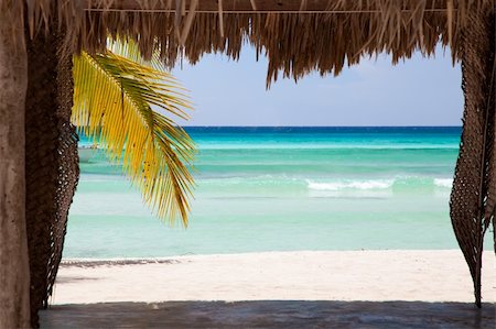 simsearch:400-08671578,k - View over the Caribbean Sea through a leaf made hut on Sahona Island in Dominican Republic. Stock Photo - Budget Royalty-Free & Subscription, Code: 400-04177863