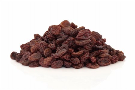 Raisins in a pile isolated over white background. Stock Photo - Budget Royalty-Free & Subscription, Code: 400-04178485