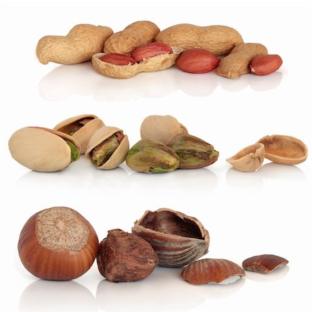 simsearch:400-04180777,k - Hazelnut, peanut and pistachio nut collection, isolated over white background with reflection. Photographie de stock - Aubaine LD & Abonnement, Code: 400-04178503