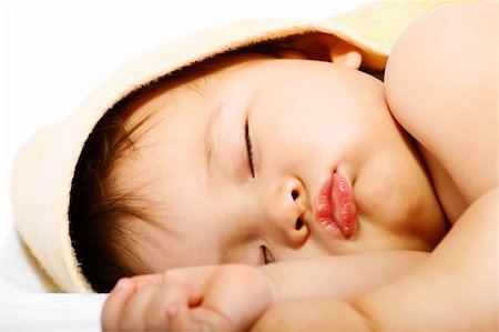 simsearch:400-04787509,k - Adorable sleeping baby. Isolated on white background. Photographie de stock - Aubaine LD & Abonnement, Code: 400-04179046