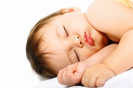 simsearch:400-04787509,k - Adorable sleeping baby. Isolated on white background. Photographie de stock - Aubaine LD & Abonnement, Code: 400-04179079