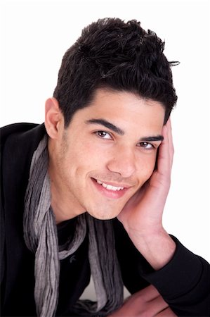 simsearch:400-04643781,k - Handsome young man smiling with his head resting in his hand. Studio shot. Foto de stock - Super Valor sin royalties y Suscripción, Código: 400-04179498