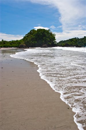 View over a beautiful caribbean beach in Manuel Antonio beach, Costa Rica. Photographie de stock - Aubaine LD & Abonnement, Code: 400-04179500