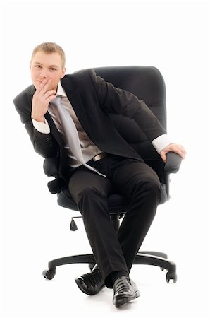 simsearch:400-06565728,k - Young man sitting in chair. Isolated over white. Foto de stock - Super Valor sin royalties y Suscripción, Código: 400-04179599