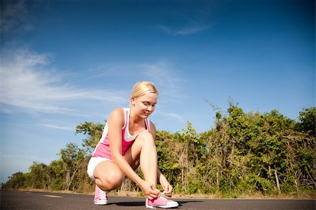 simsearch:400-07918985,k - Young woman runner prepairing for training. Sport collection. Stock Photo - Budget Royalty-Free & Subscription, Code: 400-04170425