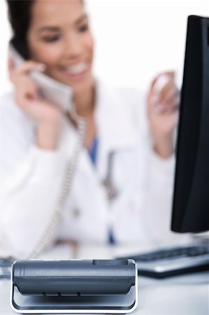 doctor business computer - Telephone of focus, doctor talking with it over white background Stock Photo - Budget Royalty-Free & Subscription, Code: 400-04171409