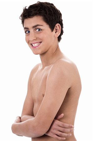 Boy giving strange expression and smiling isolated on white background Stockbilder - Microstock & Abonnement, Bildnummer: 400-04171804