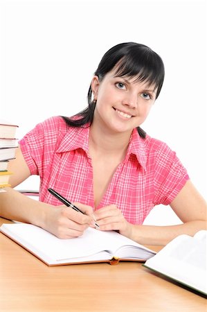 simsearch:400-04175049,k - Girl doing homework on a white background Stock Photo - Budget Royalty-Free & Subscription, Code: 400-04171931