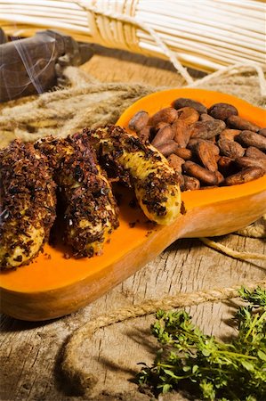 simsearch:622-02758620,k - Banana in chocolate crumb and cocoa beans on pumpkin Stock Photo - Budget Royalty-Free & Subscription, Code: 400-04172239