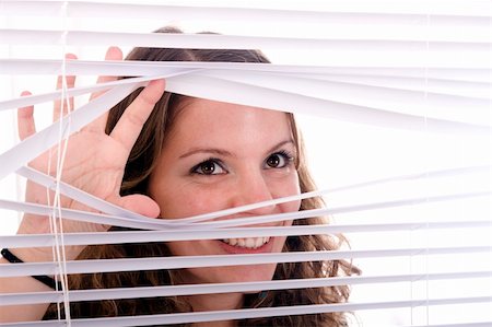 woman hands apart on the window blinds Stockbilder - Microstock & Abonnement, Bildnummer: 400-04172257