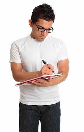 simsearch:400-04200146,k - A man writes in a spiral notebook lecture pad Stock Photo - Budget Royalty-Free & Subscription, Code: 400-04172485