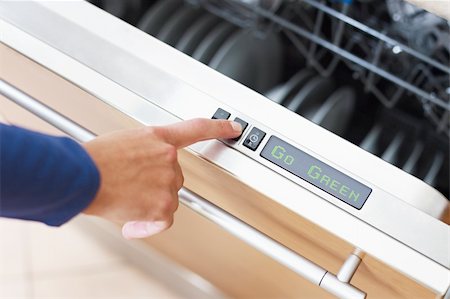 simsearch:400-07177497,k - Go Green concept. Close up of woman using dishwasher in energy saver mode. Horizontal shape Foto de stock - Super Valor sin royalties y Suscripción, Código: 400-04172593