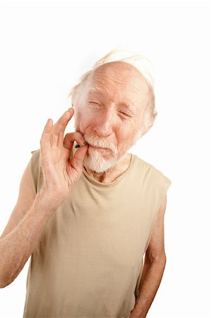 Senior man in ragged shirt smoking cigarette stub or marijuana reefer Photographie de stock - Aubaine LD & Abonnement, Code: 400-04172720