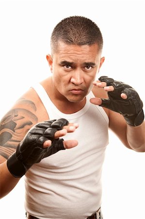 Hispanic man in t-shirt wearing mixed martial arts gloves Stock Photo - Budget Royalty-Free & Subscription, Code: 400-04172756
