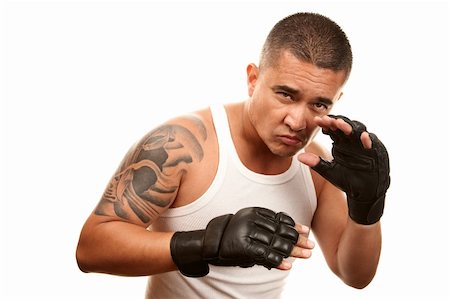 Hispanic man in t-shirt wearing mixed martial arts gloves Stock Photo - Budget Royalty-Free & Subscription, Code: 400-04172757