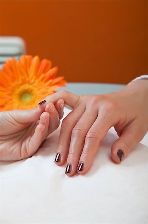 simsearch:400-06061806,k - Womans hands holding up the small finger for a manicure. Stock Photo - Budget Royalty-Free & Subscription, Code: 400-04172772