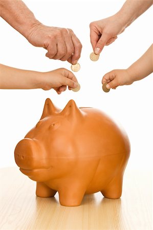 Hands of different generations putting coins in piggy bank - saving money concept Stock Photo - Budget Royalty-Free & Subscription, Code: 400-04172961