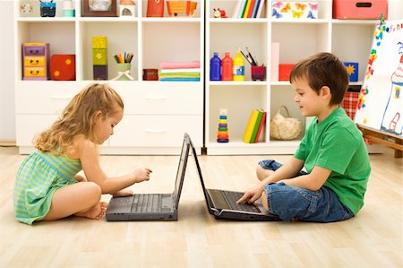 simsearch:400-04575374,k - Kids learning and playing computer games sitting on the floor with laptops Stock Photo - Budget Royalty-Free & Subscription, Code: 400-04173023