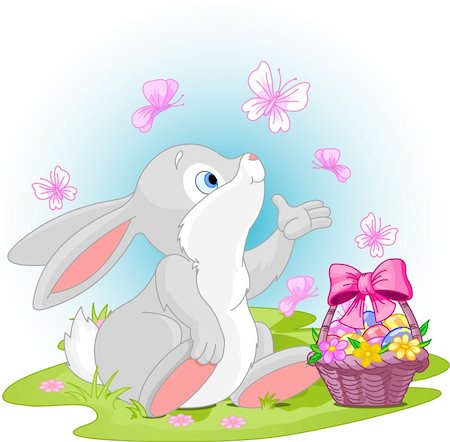 A cute Easter bunny sitting near Easter eggs basket. Stock Photo - Budget Royalty-Free & Subscription, Code: 400-04173085