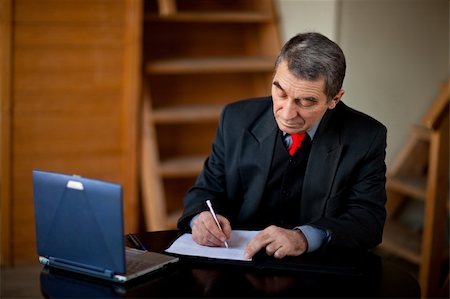 president (male) - Senior businessman writing and working with document indoors Stock Photo - Budget Royalty-Free & Subscription, Code: 400-04173100