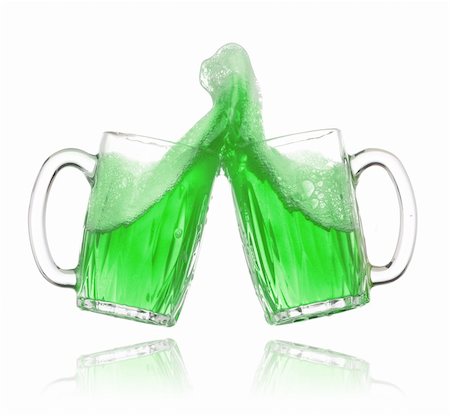 simsearch:659-03530145,k - Pair of green beer glasses making a toast. St. Patrick's Day beer splash Stock Photo - Budget Royalty-Free & Subscription, Code: 400-04173101