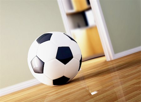 classic soccer ball on wood floor, indoor background Stock Photo - Budget Royalty-Free & Subscription, Code: 400-04173717