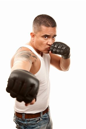 Hispanic man in t-shirt wearing mixed martial arts gloves Stock Photo - Budget Royalty-Free & Subscription, Code: 400-04173797
