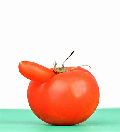 funny shaped red tomato on white background Stock Photo - Budget Royalty-Free & Subscription, Code: 400-04173981