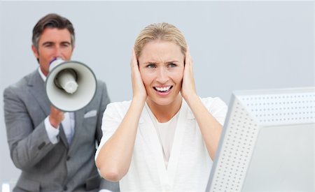 simsearch:400-04126489,k - Competitive businessman shouting through a megaphone in the office Stock Photo - Budget Royalty-Free & Subscription, Code: 400-04184217