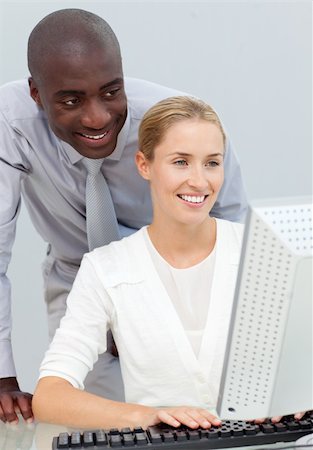 employee and employer and talk - Ethnic businessman and his colleague working at a computer in the office Stock Photo - Budget Royalty-Free & Subscription, Code: 400-04184212