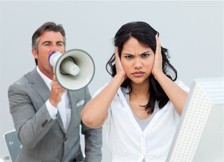 simsearch:400-04126489,k - Competitive businessman shouting through a megaphone  in the office Stock Photo - Budget Royalty-Free & Subscription, Code: 400-04184245