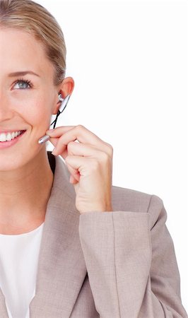 simsearch:400-03912315,k - Close-up of a smiling businesswoman using headset isolated on a white background Photographie de stock - Aubaine LD & Abonnement, Code: 400-04184325