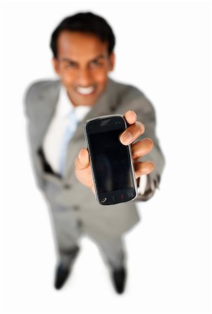 simsearch:400-07820348,k - Enthusiastic businessman showing a mobile phone isolated on a white background Photographie de stock - Aubaine LD & Abonnement, Code: 400-04184374