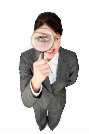 simsearch:400-04554899,k - Young businesswoman looking through magnifying glass against a white background Stock Photo - Budget Royalty-Free & Subscription, Code: 400-04184431