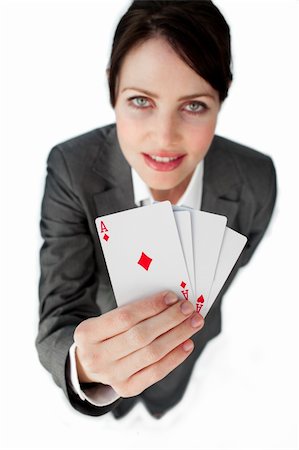 simsearch:400-05081220,k - Charming businesswoman holding a full deck aces against a white background Foto de stock - Super Valor sin royalties y Suscripción, Código: 400-04184447