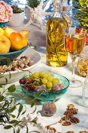 simsearch:400-07260354,k - Still life with grape, pear, feta, wine, oil and plants Stockbilder - Microstock & Abonnement, Bildnummer: 400-04184502