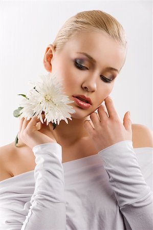 simsearch:400-06096871,k - beauty portrait of young cute blond girl with white top and some flowers near face Stock Photo - Budget Royalty-Free & Subscription, Code: 400-04184515