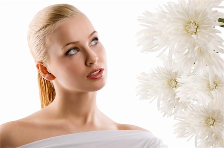 simsearch:400-06096871,k - beauty portrait of young cute blond girl with white top looking at some flowers Stock Photo - Budget Royalty-Free & Subscription, Code: 400-04184516