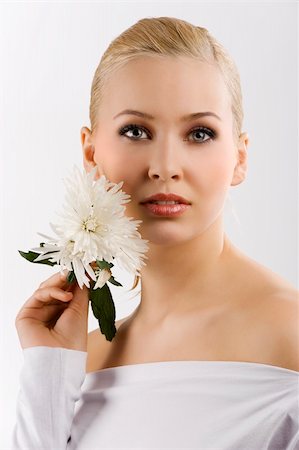 simsearch:400-06096871,k - beauty portrait of young cute blond girl with white top and some flowers near face Stock Photo - Budget Royalty-Free & Subscription, Code: 400-04184512