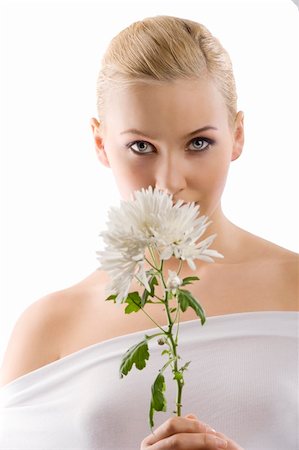 simsearch:400-03914122,k - beauty portrait of young cute blond girl with white top and some flowers near face . wellness concept Foto de stock - Super Valor sin royalties y Suscripción, Código: 400-04184513