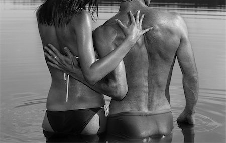 Man and woman are embracing standing in water / black and white photo Stockbilder - Microstock & Abonnement, Bildnummer: 400-04184617