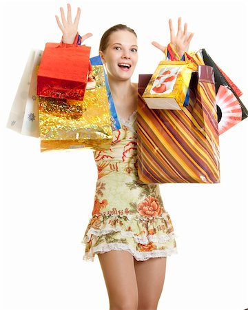 young woman brag of her purchases rising both hands with shopping bags Stock Photo - Budget Royalty-Free & Subscription, Code: 400-04184763