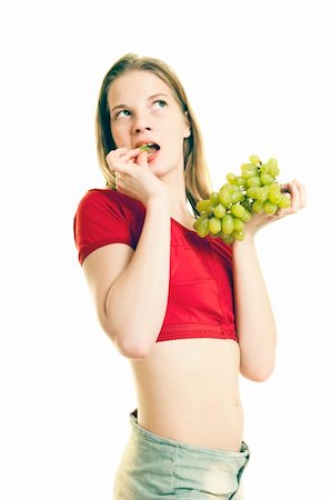 portrait of slim girl enjoying green  grapes on white background Stock Photo - Budget Royalty-Free & Subscription, Code: 400-04184782