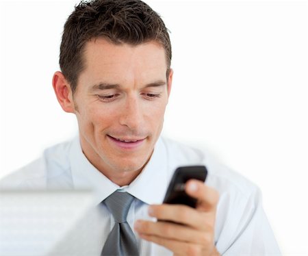 simsearch:400-04782151,k - Portrait of a businessman sending a text isolated on a white background Photographie de stock - Aubaine LD & Abonnement, Code: 400-04184818
