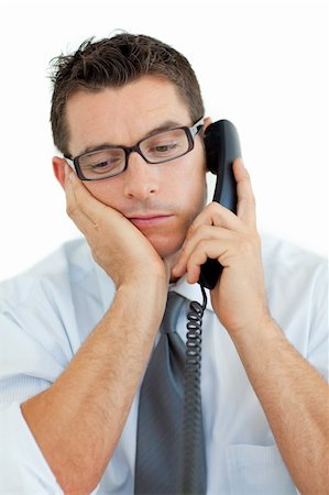simsearch:400-04180586,k - Young businessman sleeping on phone against a white background Stockbilder - Microstock & Abonnement, Bildnummer: 400-04184813