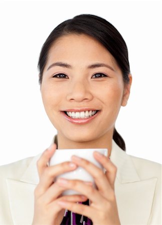 simsearch:400-04188263,k - Charming businesswoman drinking coffee isolated on a white background Foto de stock - Super Valor sin royalties y Suscripción, Código: 400-04184854