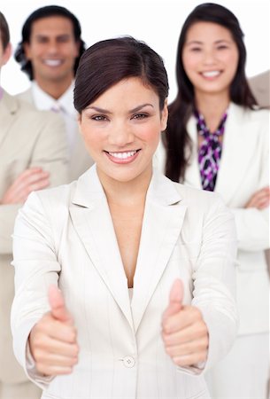 simsearch:400-04187328,k - Attractive businesswoman and her team with thumbs up  against a white background Foto de stock - Royalty-Free Super Valor e Assinatura, Número: 400-04184906