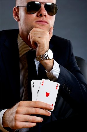simsearch:400-04795607,k - picture of a businessman holding a poker hand - pair of aces Stock Photo - Budget Royalty-Free & Subscription, Code: 400-04184986